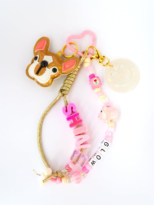 grigri sac chien doré