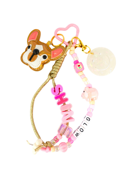 grigri de sac chien - rose et doré